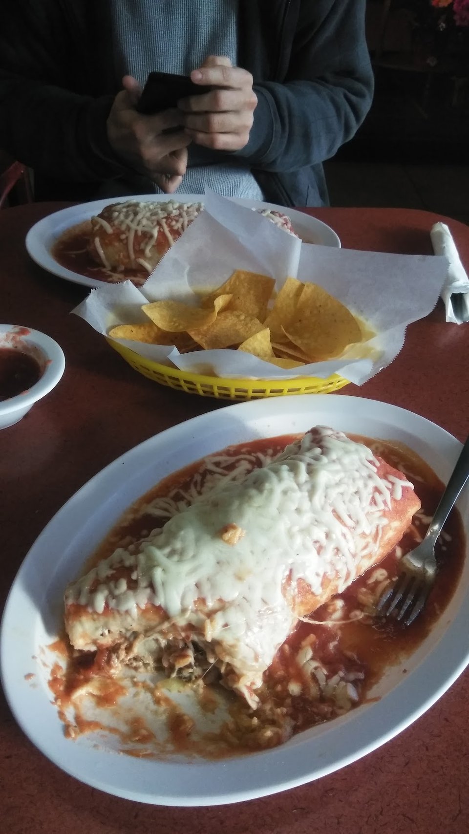 Close view of a menu with tacos and sopes.