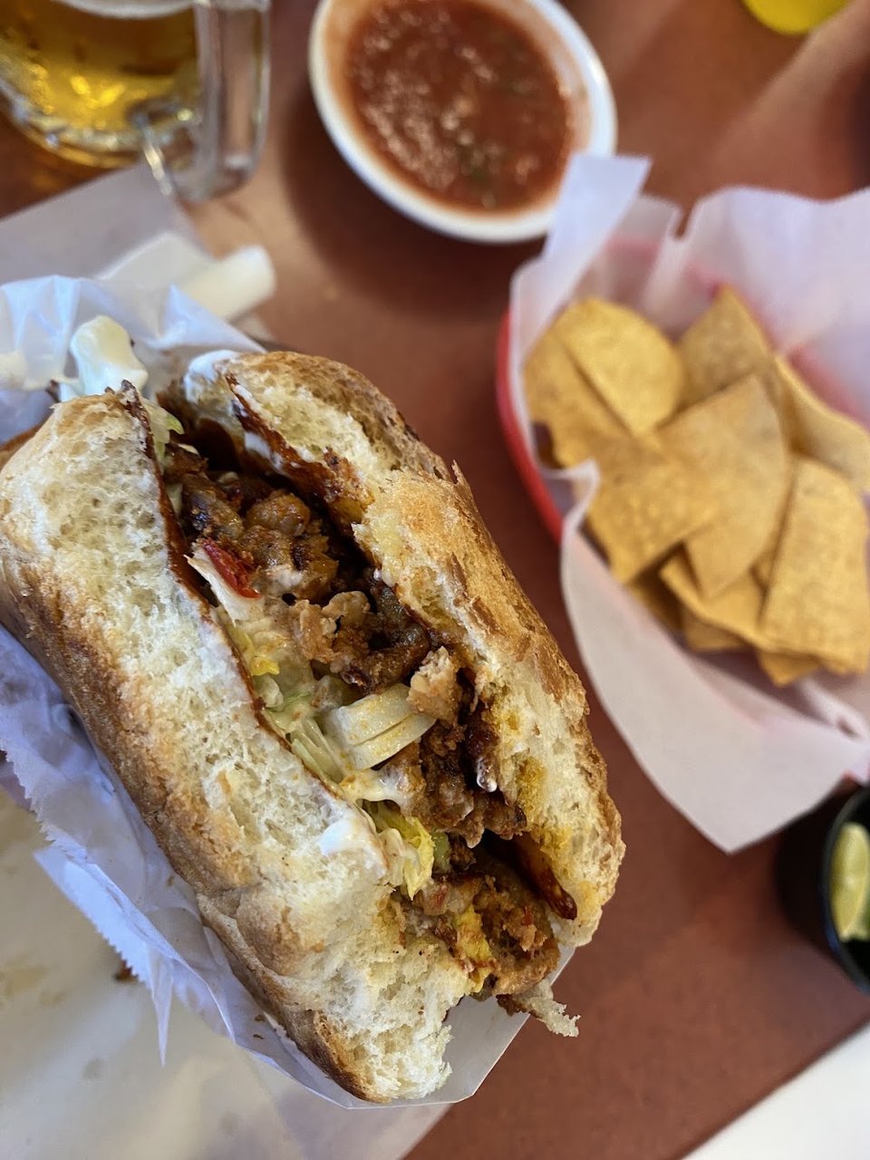 Close view of a menu with tacos and sopes.