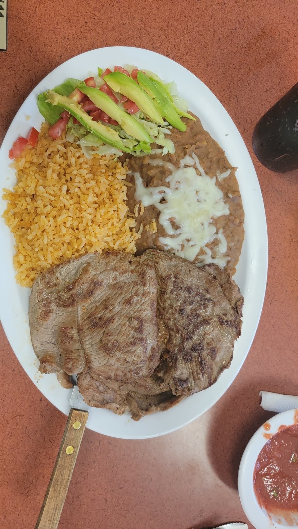 Close view of a menu with tacos and sopes.